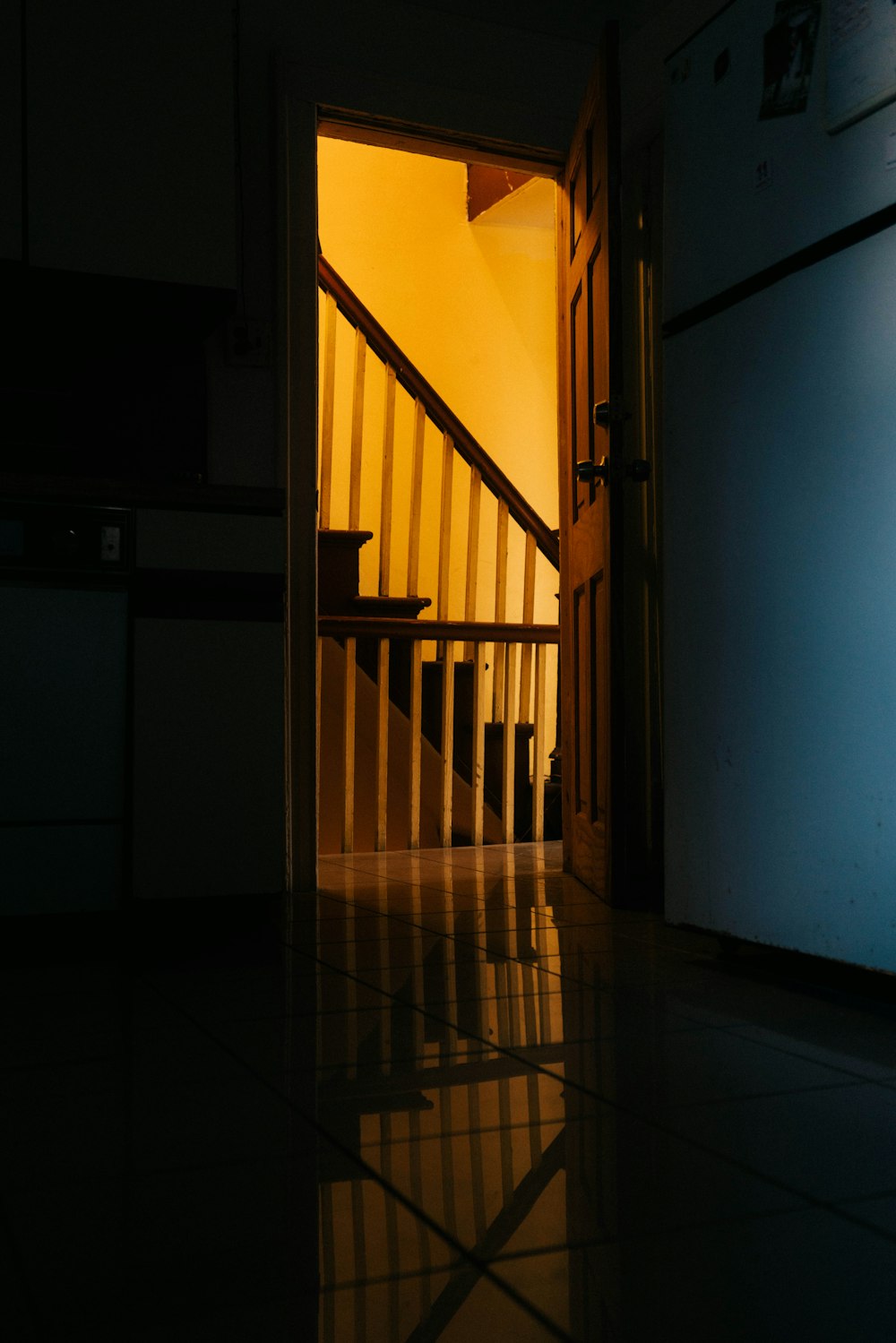 brown wooden staircase on white wall