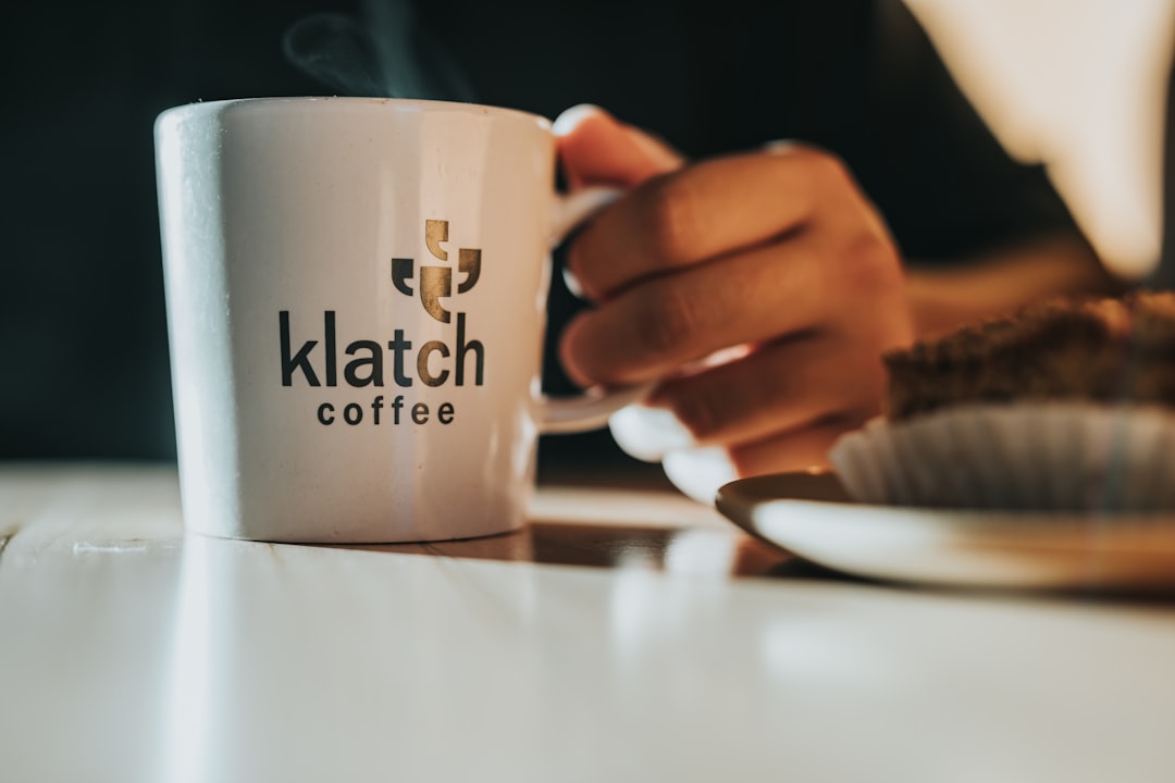 white ceramic mug on table