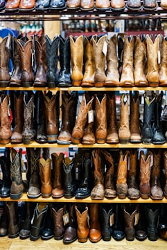 brown leather cowboy boots on brown wooden table
