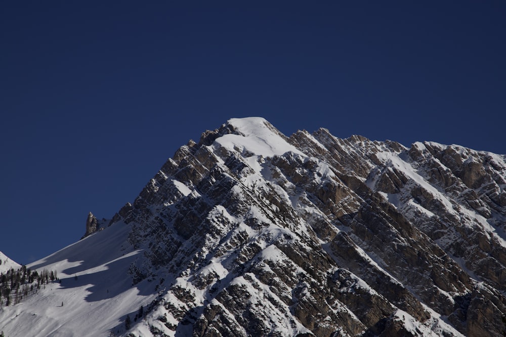 snow covered mountain under blue sky during daytime