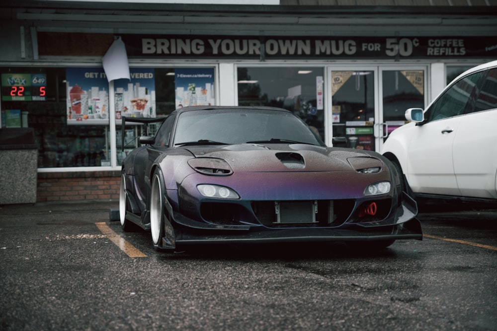 red ferrari 458 italia parked in front of UNKs store