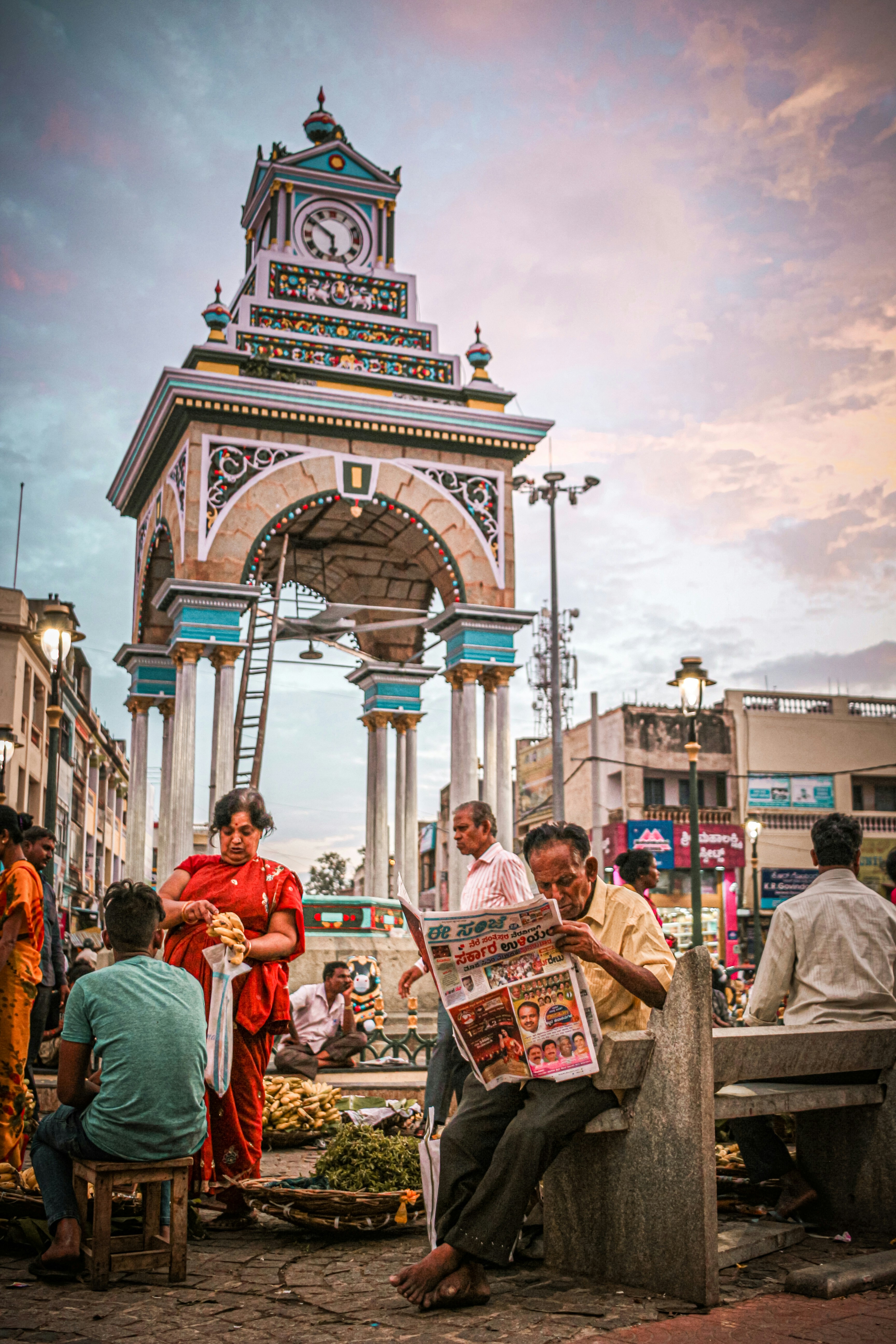 people in red shirts standing near white concrete building during daytime