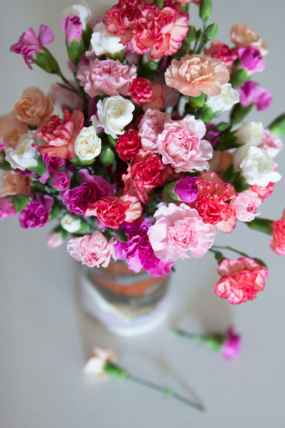 pink flowers in clear glass vase