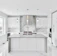 A beautifully renovated kitchen featuring modern appliances and elegant design elements.