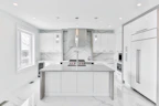 Minimalist kitchen with stone countertops and natural light pouring in