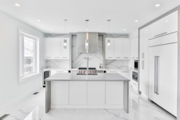 white wooden kitchen cabinet with mirror