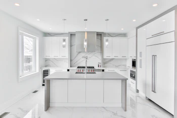 Modern kitchen remodel featuring quartz countertops and custom cabinetry.