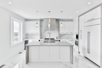 Modern custom kitchen with elegant finishes and bright lighting.