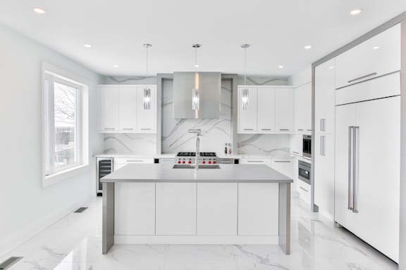 A beautifully designed kitchen featuring sleek, modern cabinetry with a clean aesthetic.