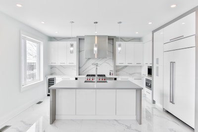 white wooden kitchen cabinet with mirror