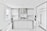 A modern, sleek kitchen featuring minimalist design with white cabinetry and marble countertops. The room includes stainless steel appliances, hanging pendant lights, and a large central island. Large windows provide ample natural light.