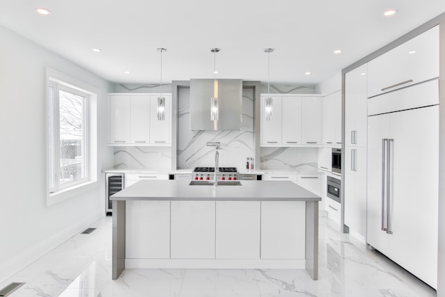 Modern custom kitchen with elegant finishes and bright lighting.