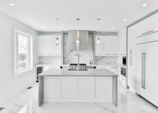 white wooden kitchen cabinet with mirror