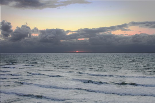 ocean waves crashing on shore during sunset in Biarritz France