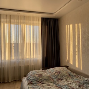 white and brown window curtain