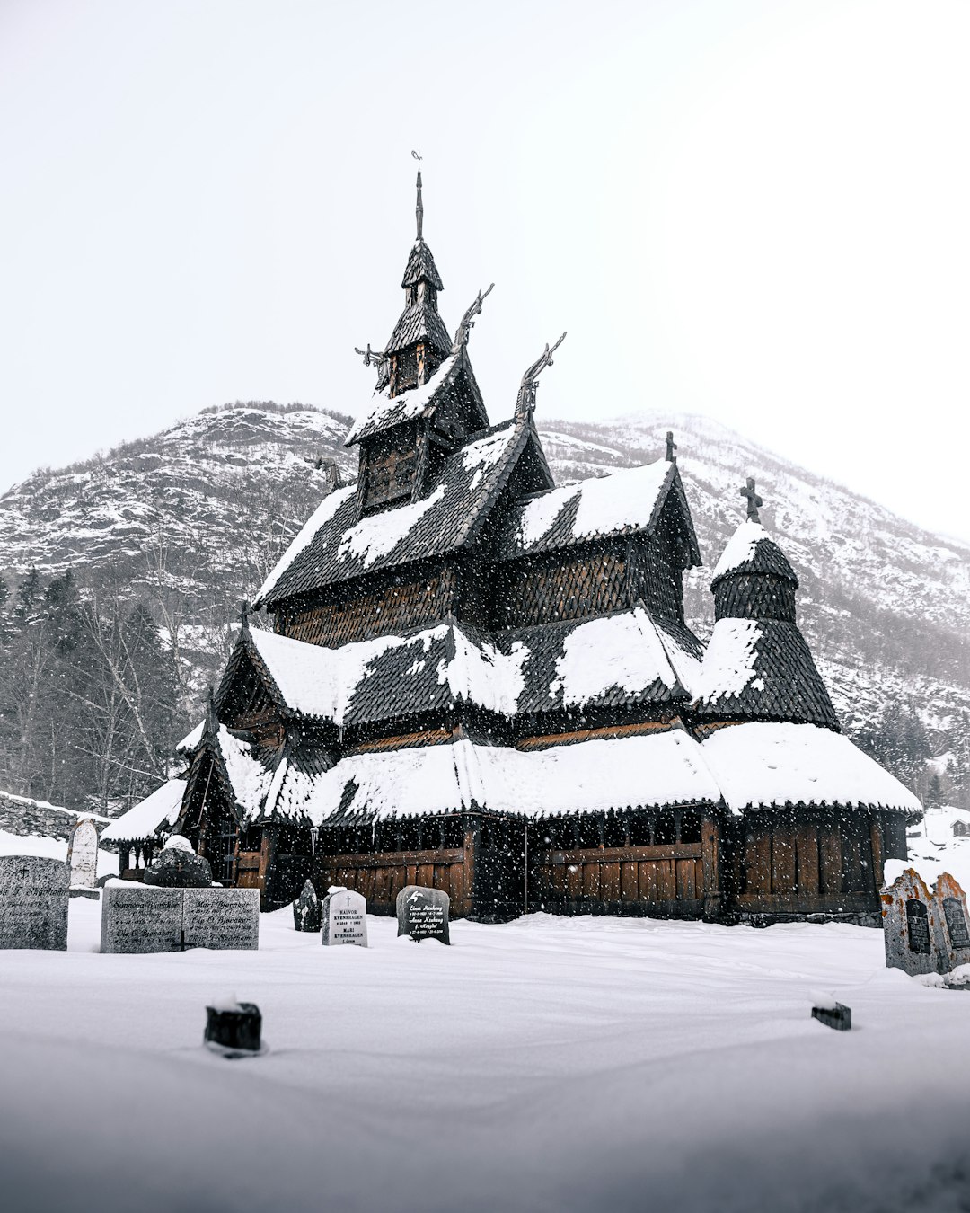 brown and white concrete building on snow covered ground