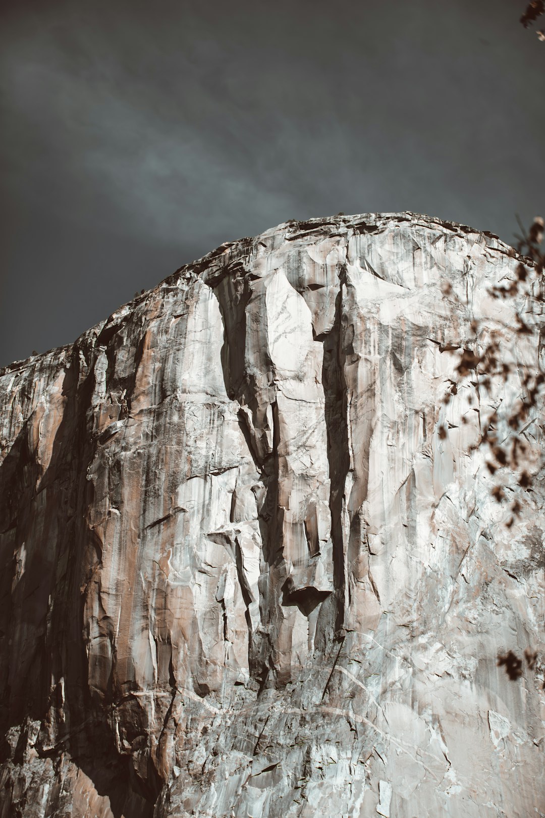 brown rocky mountain under cloudy sky during daytime