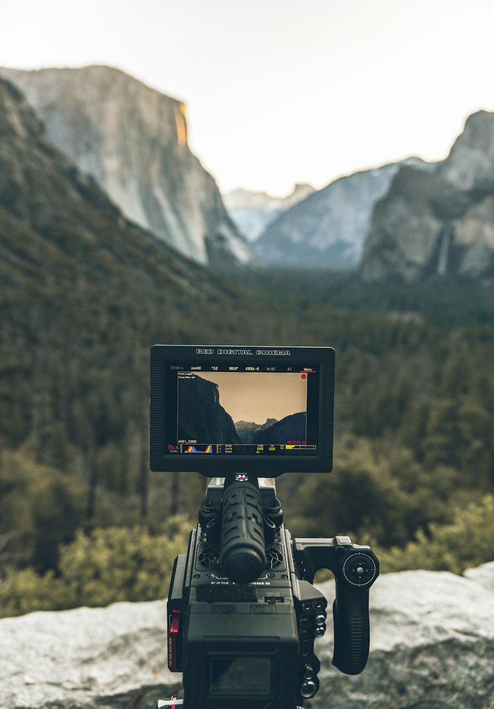 black dslr camera on brown wooden table