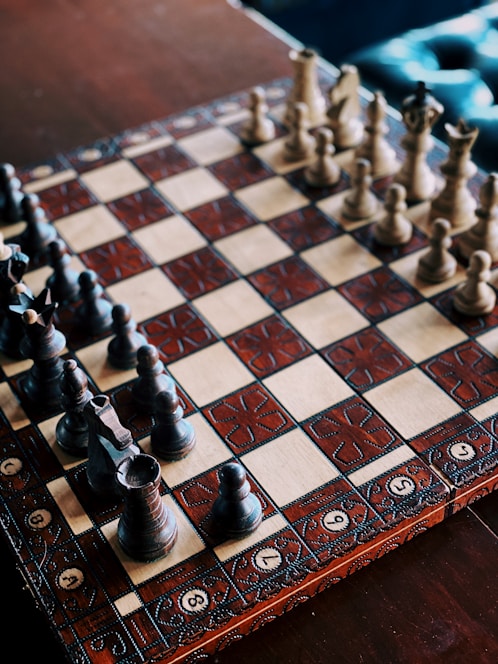 A beautifully arranged chessboard with pieces set up, showcasing a strategic game.