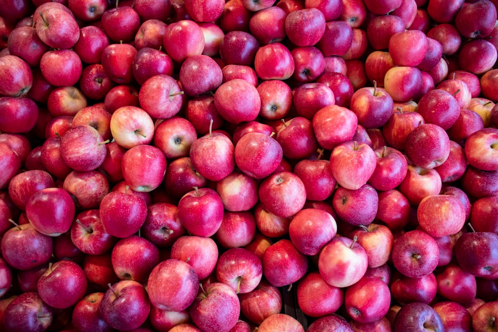 red round fruits on brown wooden table