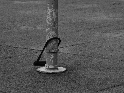 Close-up of a freshly installed concrete pole with visible texture and sturdy base.