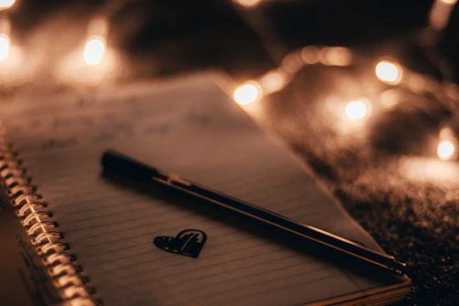 A notebook open with heartfelt notes and relationship goals written inside.