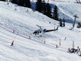 white and red cable car over snow covered mountain during daytime