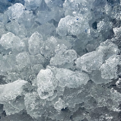 A close-up of ice cubes glistening in the light.