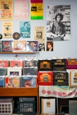 assorted vinyl record on brown wooden shelf