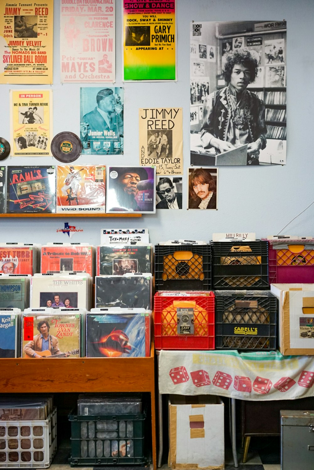 assorted vinyl record on brown wooden shelf