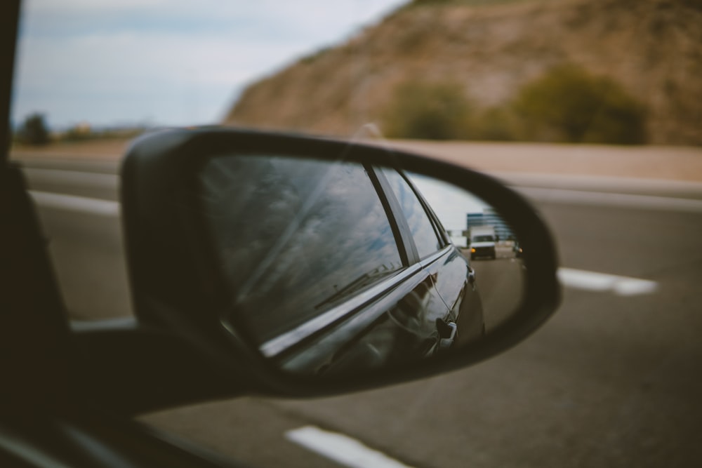 black car side mirror during daytime