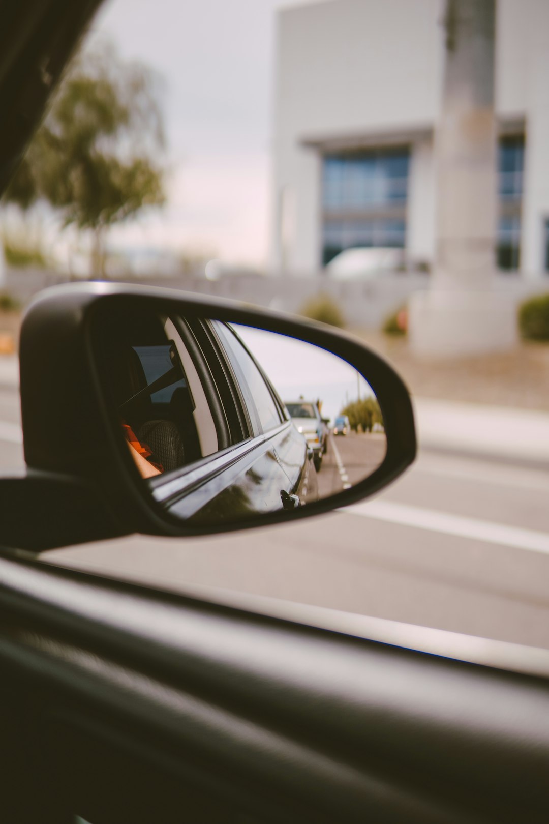 black car side mirror during daytime