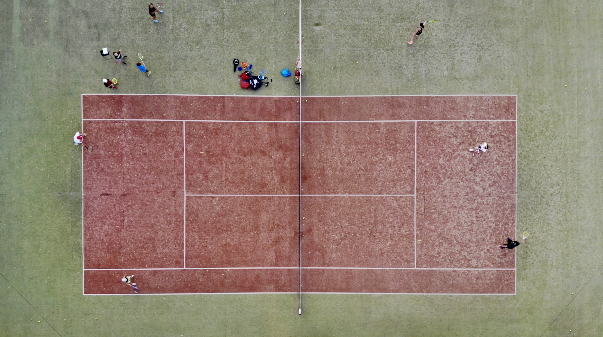 people playing soccer on field during daytime