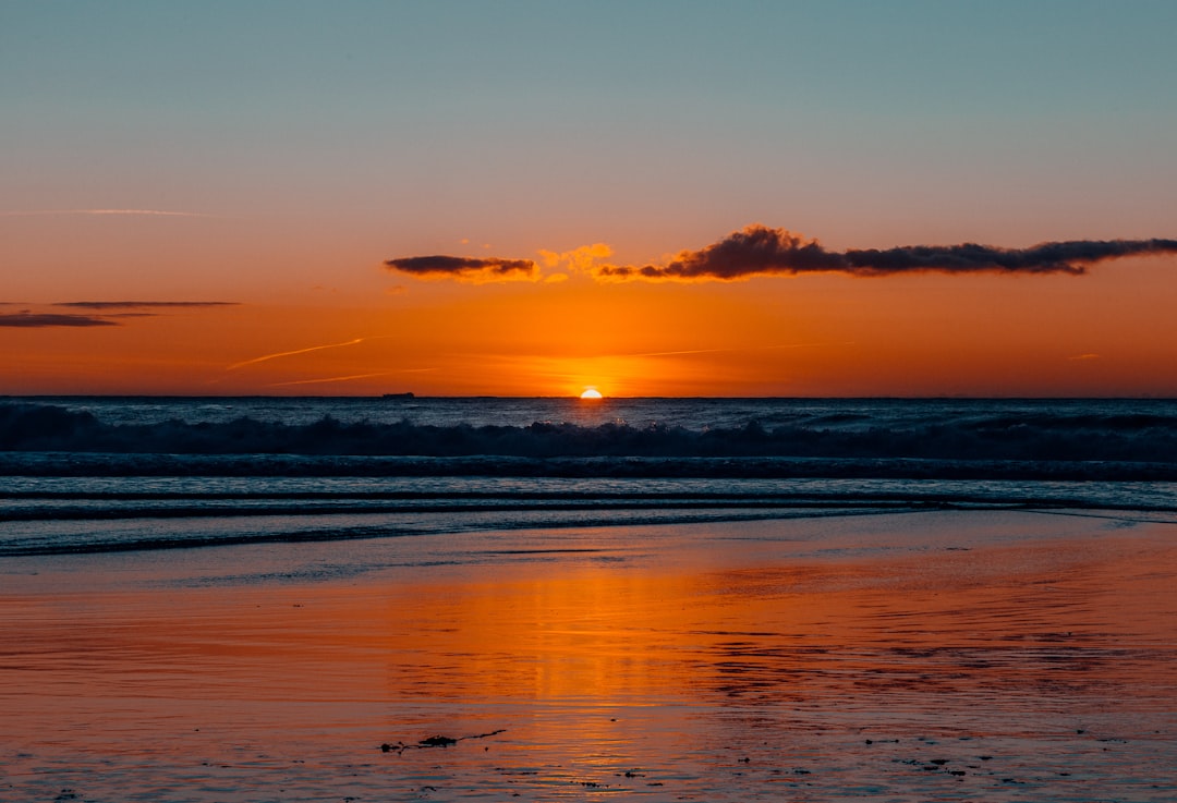 body of water during sunset