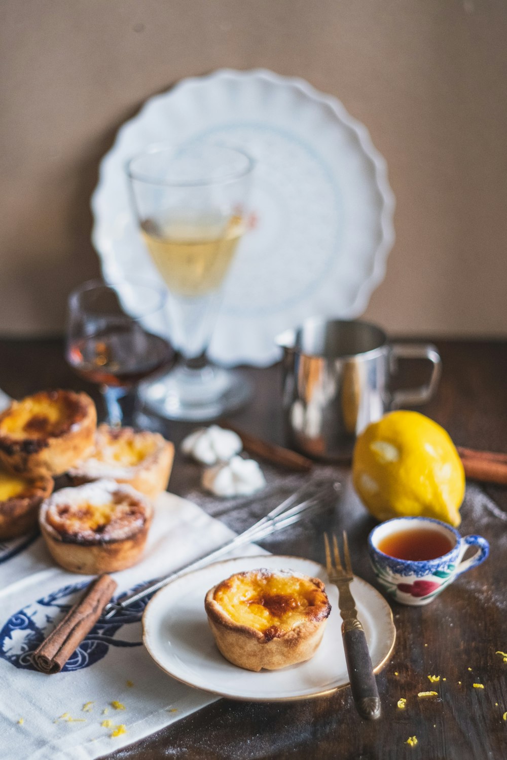 bread on white ceramic plate beside clear drinking glass