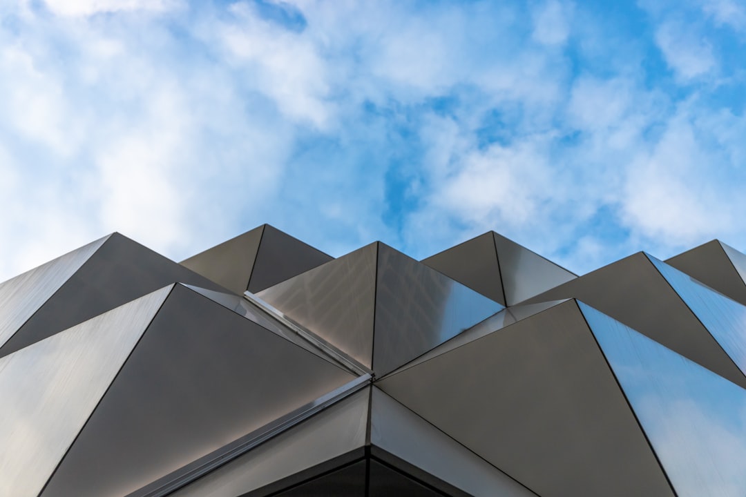 grey concrete building under blue sky during daytime