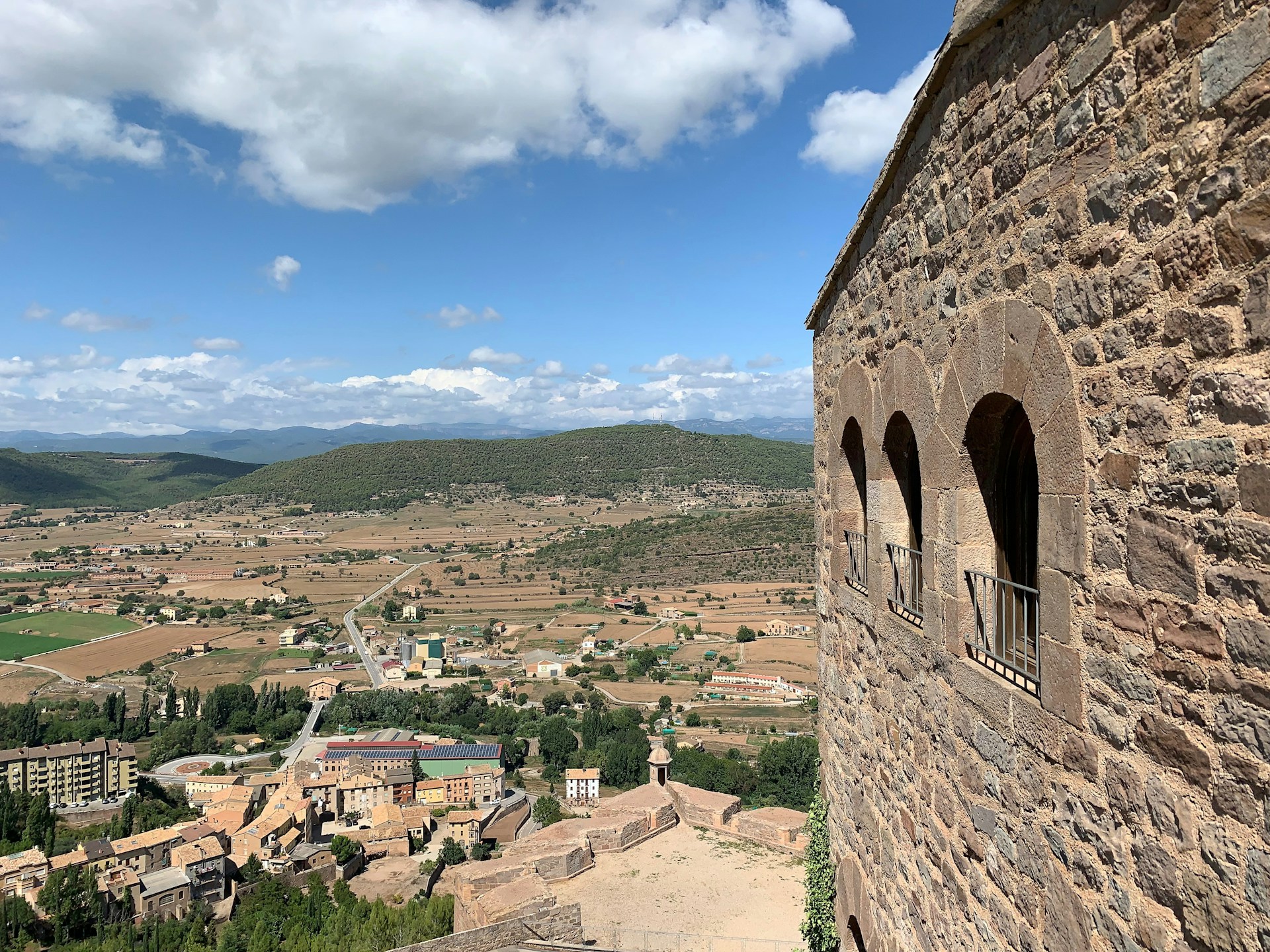 woman wearing yellow long-sleeved dress under white clouds and blue sky during daytime