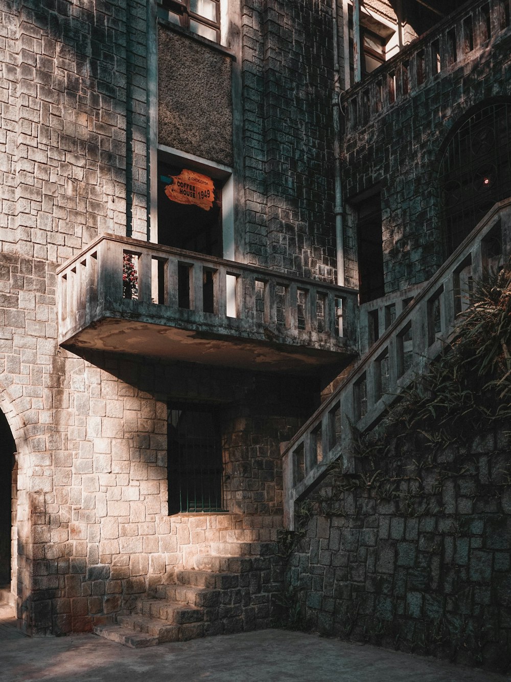 brown concrete stairs with black metal railings