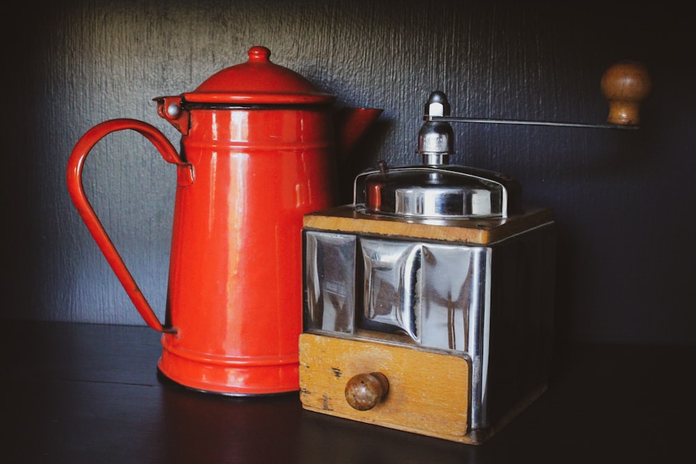 red and silver steel teapot