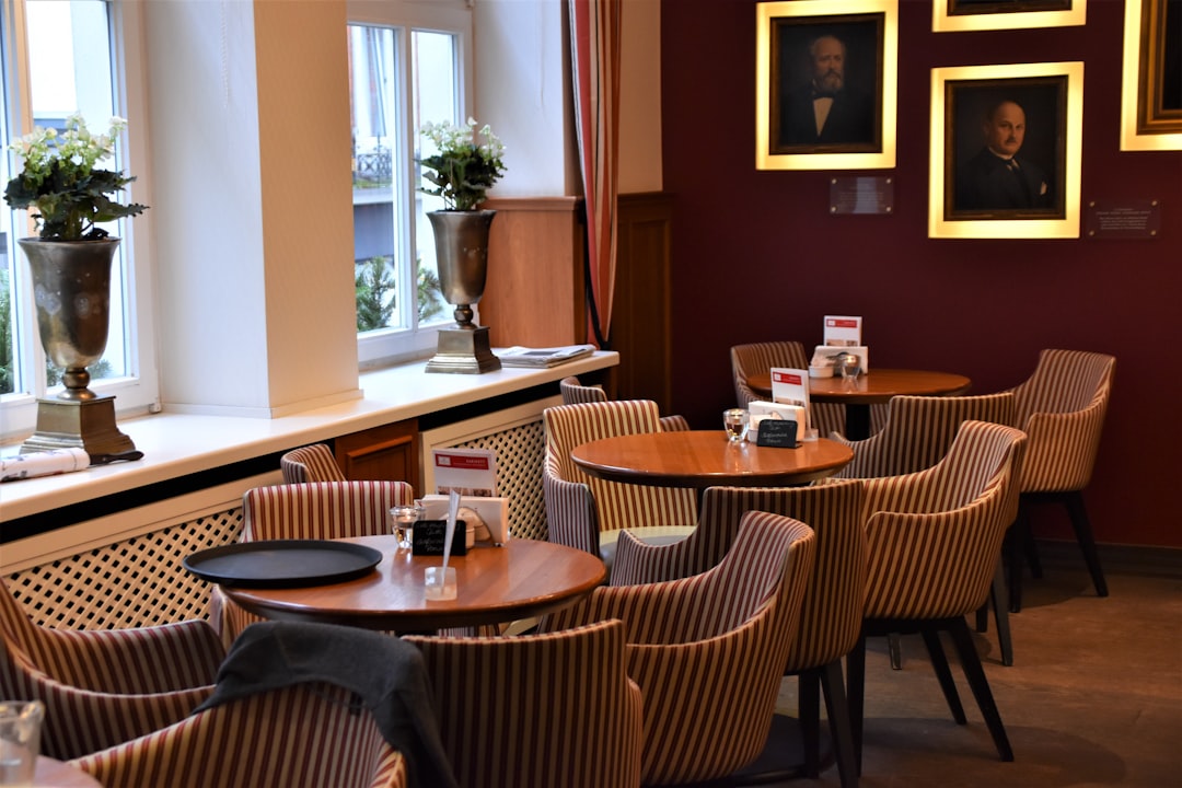 brown wooden table with chairs, Old café house with colourful interior