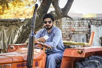 Customer receiving tractor parts package via WhatsApp order