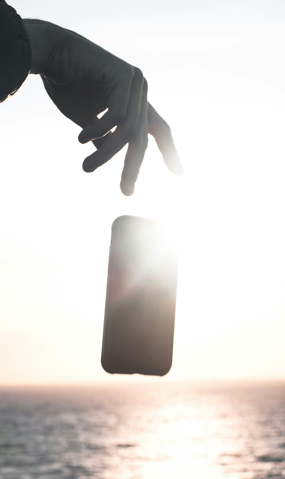 persons hand near white light