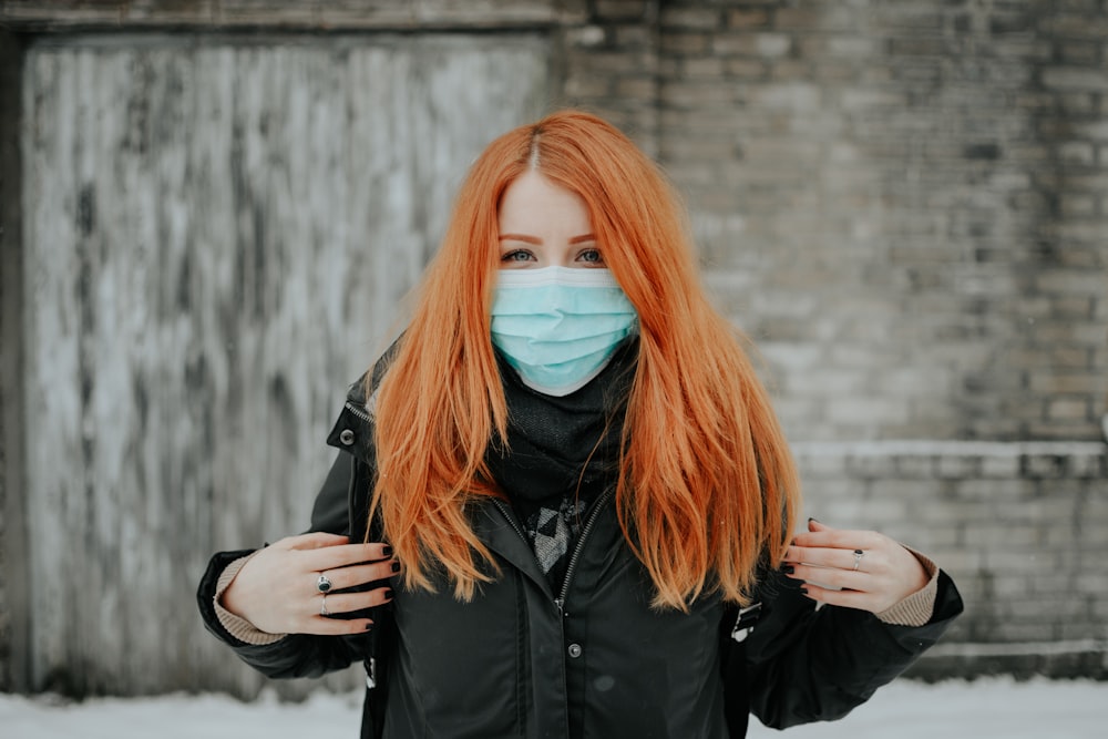 woman in black jacket wearing black framed eyeglasses