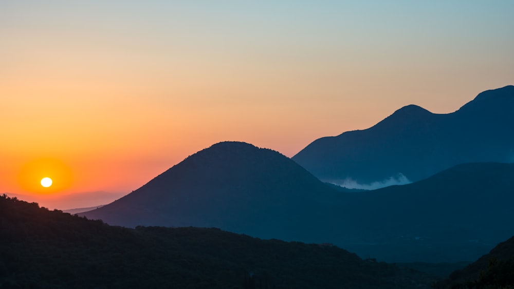 silhouette of mountain during sunset