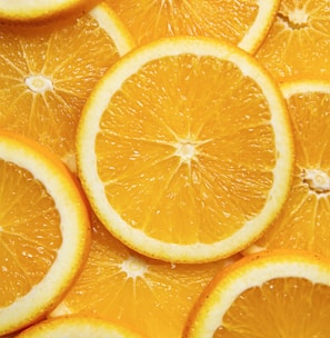 sliced orange fruit on white ceramic plate