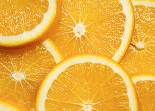 sliced orange fruit on white ceramic plate