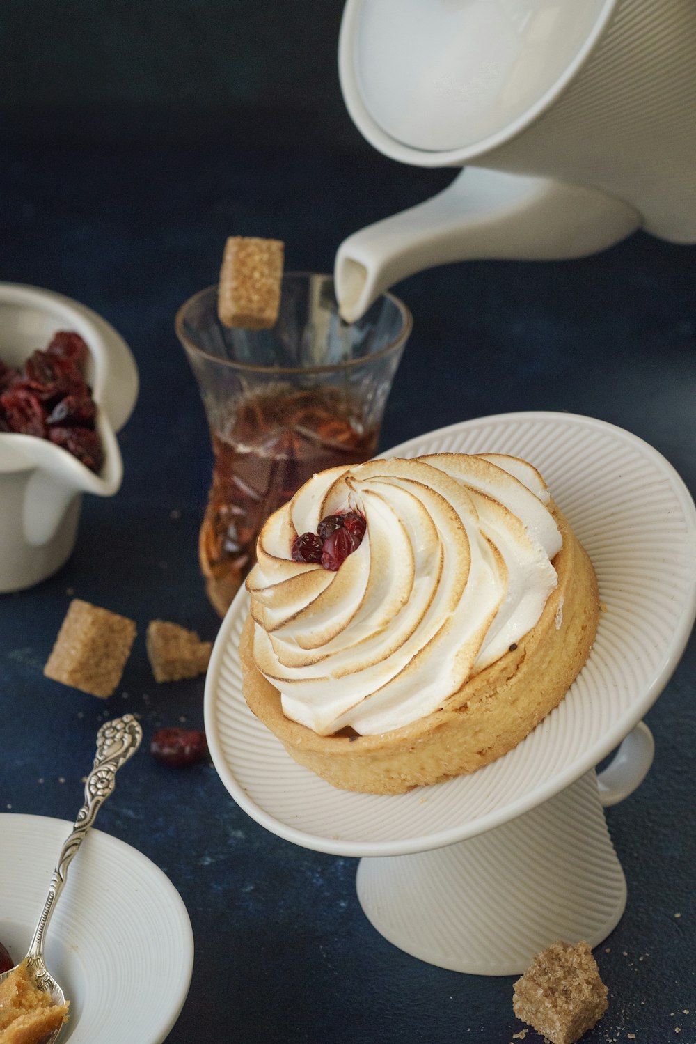 white and brown cupcake on white ceramic plate