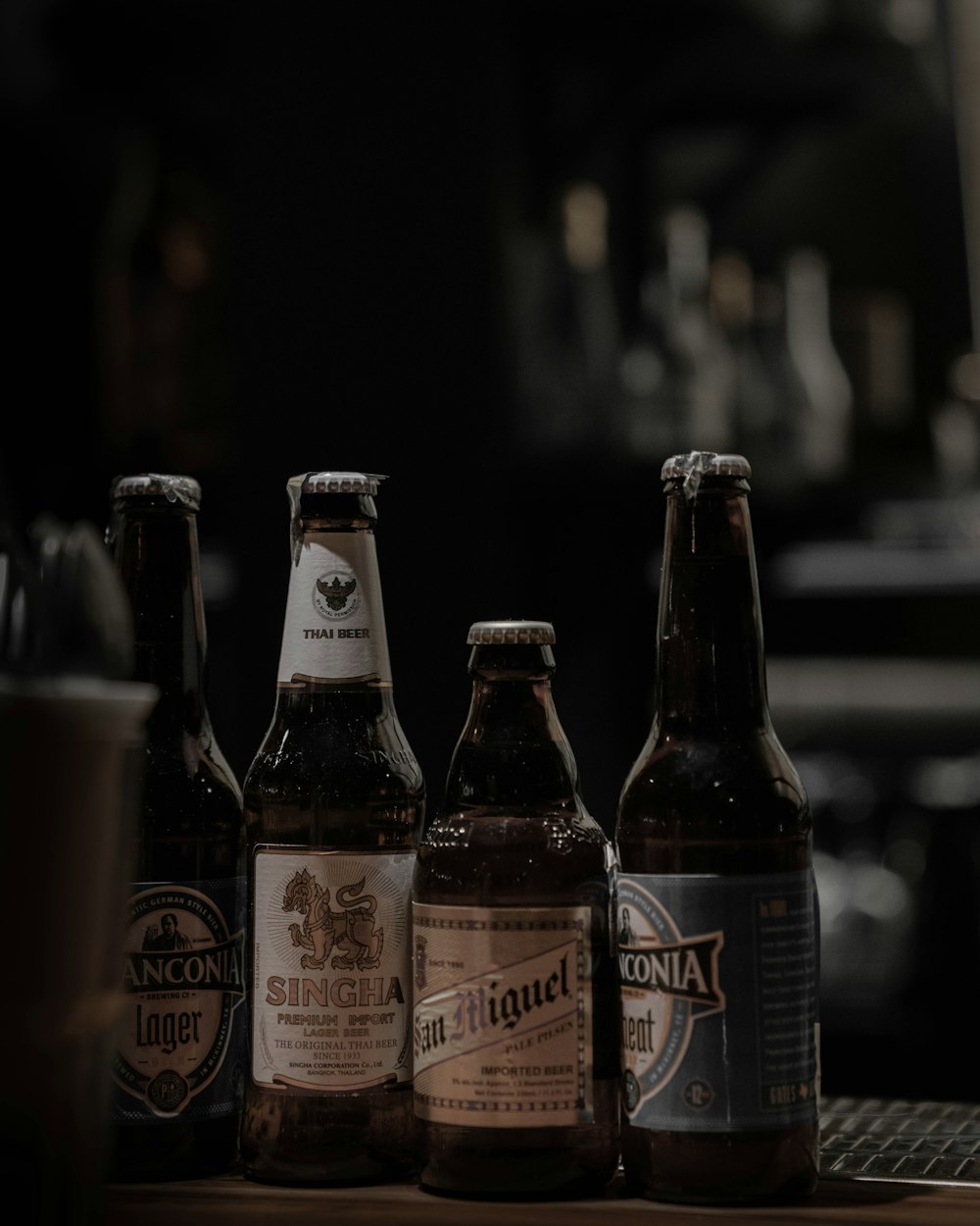selective focus photography of brown glass bottle