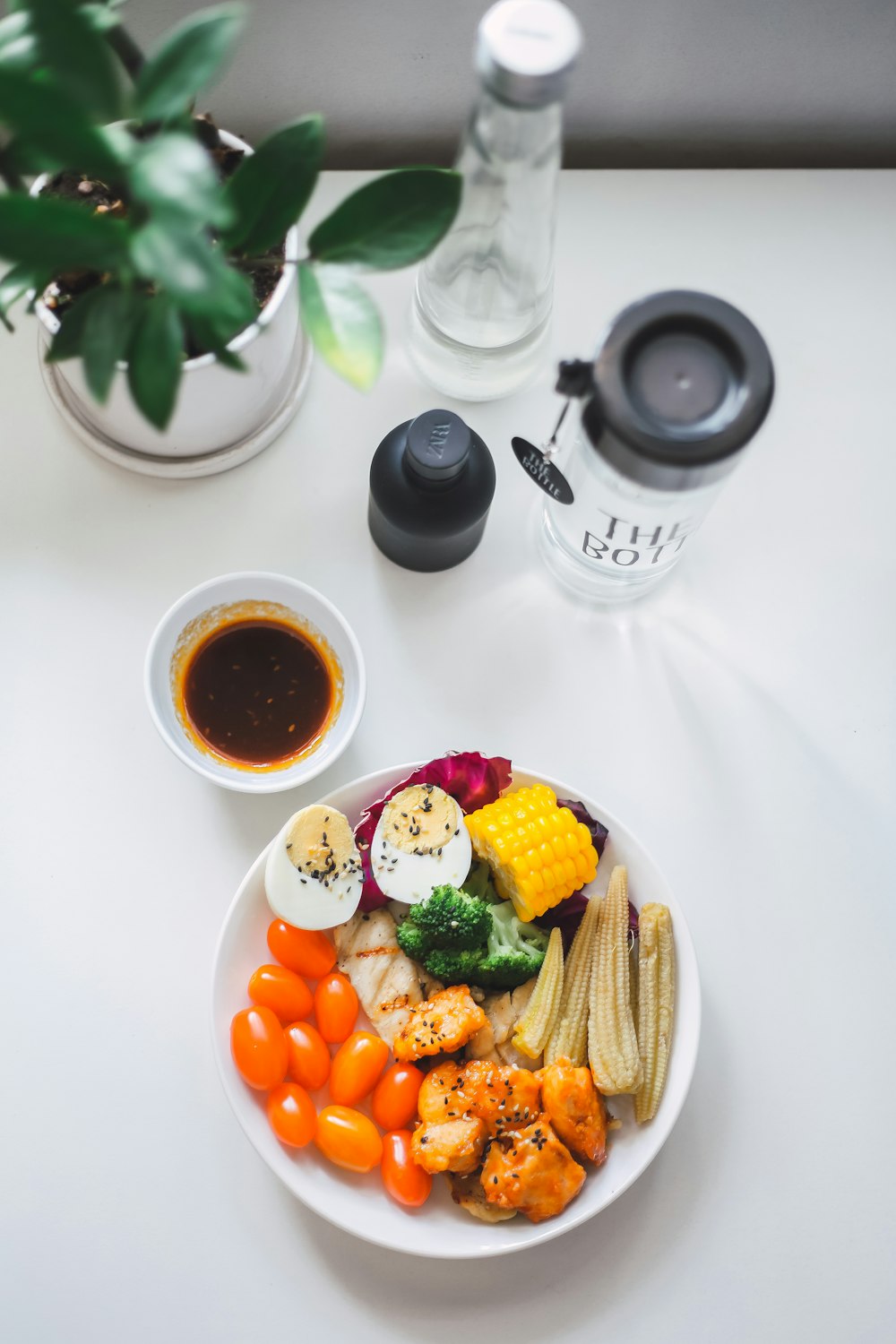 corn and carrots on white ceramic plate