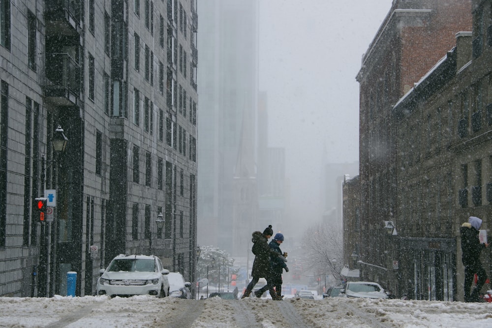 person in black jacket walking on street during daytime